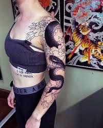 Thigh snake in flowers tattoo. Top 130 Best Snake Tattoos For Women Slithering Designs