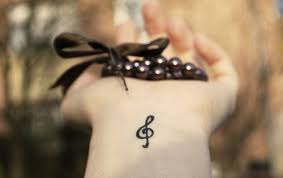 Music is more than the notes and song lyrics, music has meaning and gives life purpose for many of us. Small Treble Clef Wrist Tattoo Design Idea Tattoos At Repinned Net