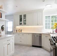 One simple color swap makes these gloomy kitchens refreshingly bright and modern. Vintage White Luxe Cabinet Stone