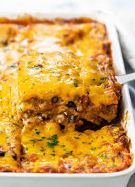 A delicious meat sauce layered with cheese and spinach filled ravioli and loads of gooey cheese and cooks up perfectly in the slow cooker. Taco Lasagna No Boiling Needed The Cozy Cook