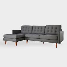 It's made with a solid wood frame, and is upholstered in a polyester velvet fabric. Ennis Tufted Dark Gray Left Facing Sectional Sofa