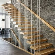 Stairs With A See Through Supporting Wall Are A Sure Way To Give The Illusion Of A Bigger Home The Br Stair Railing Design Stairs Design Modern Railing Design