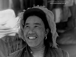 Young Tibetan woman being shy. Yarlung Valley, Tibet. 1986, Kodachrome.