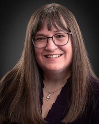 Barb Embacher is filling the position through the end of June. She  previously was the college's dean of career and technical education. South  Central College