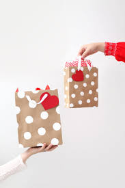 Next, put your gift into the bag so it's surrounded by tissue. How To Make Professional Looking Gift Bags A Beautiful Mess