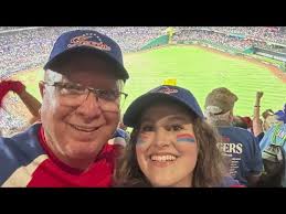 Granddaughter takes her grandfather to World Series a decade after he took  her
