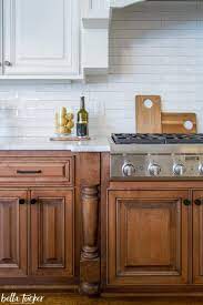 French country kitchen cream cabinets with wood floor. Wood White Subway Tile Bella Tucker