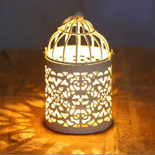 White Bird Cage Candle Holder Find More Candle Holders Information About Zakka White Birdcage Candle Holders Wedding Decoration Metal With Images Candle Holders Wedding Bird Cage Candle Candle Lanterns
