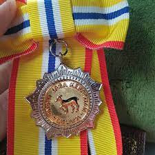 'pingat jasa kebaktian' (pjk) is amongst the national titles given by the malaysian government and is presented by the governor on his birthday to people contributing to the community. Yatt Kecik Pingat Jasa Kebaktian P J K