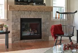 Natural gas insert fireplace with stone and wood. Natural Stone Veneer Popular Choice For Fireplace Project Fusion Stone