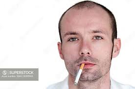 Young man with a cigarette in the corner of his mouth