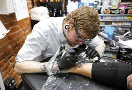 Dusty neal, store owner, says they had to push back all their appointments from the last month. Dubuque Tattoo Shop Event Helps Put Together Pieces Of Autism Puzzle Tri State News Telegraphherald Com