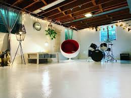 Painted concrete walls and a canvas drop cloth wall emily. The Top 30 Unfinished Basement Ideas Interior Home And Design
