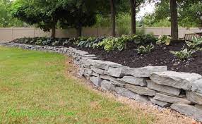 Build A Stacked Stone Garden Wall Stone Landscaping Stone Walls Garden Stacked Stone Walls
