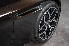Image result for Marron Black 2017 Aston Martin