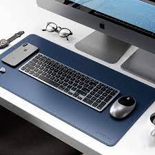 Protect your desk space in style with the blue polygon desk pad. The Best Desk Pads To Improve Your Workspace