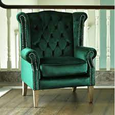 Modern wingback chairs can be used in a variety of different ways around the home and they're not only dedicated to libraries and formal living rooms. Hyde Park Home Emerald Oak Duke Wingback Armchair Temple Webster