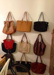 We offer wall hooks and hook racks in a range of sizes and decor styles. Purses Hung On The Wall With Command Hooks Purse Storage Command Hooks Handbag Storage