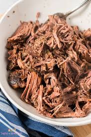Turn the slow cooker to low, and remove meat to a large bowl with a slotted spoon. Slow Cooker Shredded Beef Sandwiches Tastes Of Homemade