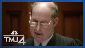 Who is Lynn Adelman -- the federal judge presiding over the Dugan case in  Milwaukee?