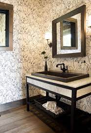 A white door opens to a beautiful transitional powder room featuring a wall covered in mushroom colored grasscloth and trimmed with white baseboards accented by an oval window framed in white sitting above a round brass accent table on diamond patterned black marble floors illuminated by a glass chandelier. 40 Stunning Powder Room Ideas Half Bath Decor Design Photos
