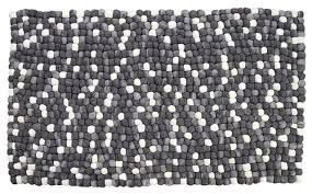 The braided texture makes the rug easier to keep clean, and the gray is calming. In Stock Amala Handmade Wool Felt Pebble Rug Gray Contemporary Area Rugs By G Furn Houzz
