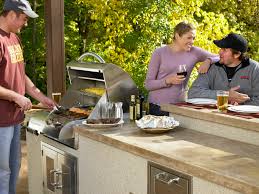 This outdoor kitchen is made of stones set on a deck. 10 Things You Must Know Before Planning An Outdoor Kitchen Patio Productions