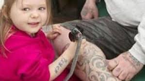 The three-year-old gets tattoos