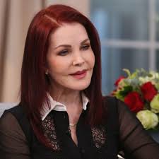 June 30, 1972: Elvis and Mary Kathleen Selph, riding his 1971  Harley-Davidson FLH Electra-Glide motorcycle in Memphis at the corner of  South Parkway and Elvis Presley Boulevard. Kathy, was a dancer and