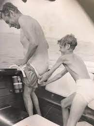 A day of fun on the lake, 1973. My dad hilariously pantsing my grandpa! :  r/OldSchoolCool