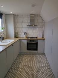 These are paired with minimalist metal handles. Matt Grey Kitchen With Oak Worktops Modern Grey Kitchen Light Grey Kitchens Grey Kitchen