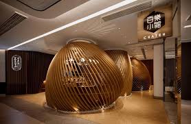 Sit Inside Fishing Basket Inspired Curvilinear Structures At This Restaurant Restaurant Design Modern Cafe Cafe Design