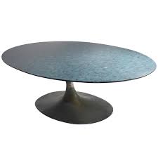 The hammered iron base is formed to create a symmetrical and solid platform to support the entire table. Maurice Burke Arkana Surfboard Coffee Table For Sale At 1stdibs