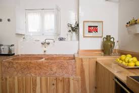 spanish kitchen with red marble sink