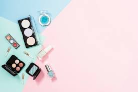 An Overhead View Of Cosmetic Products Over The Pastel Background Pastel Background Poster Background Design Makeup Artist Logo