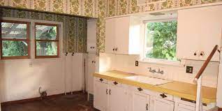 Various cupboard sizes, wood and glass panel doors, in great condition considering the age. See This Grimy 1930s Kitchen After A Sleek And Modern Makeover