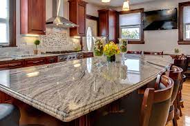 Light a row of windows positioned over a white apron sink boasting a pull out faucet mounted to. Viscont White Granite Countertops With Cherry Cabinets Contemporary Kitchen Boston By Stone Projects Houzz
