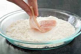 I use seasoned flour — you can put a couple of spices or the whole pantry of them, that's up to you, she continues. Dredging Chicken In Flour Stock Photo Dissolve