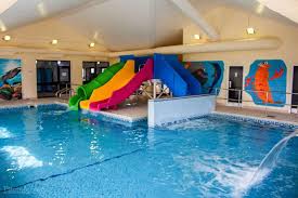 Indoor Swimming Pool With Slides Indoor Swimming Pools Swimming Pools Swimming Pool House