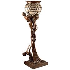 Art deco table lamps feature adventurous patterns and colors in their shades and are built with a stable base that comes in. Art Nouveau Figural Floor Lamp Nude Woman And Man Rare Reproduction Tiffany At 1stdibs