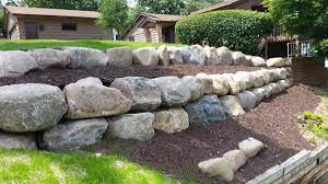 Boulder retaining wall landscape design provides durability, stability and aesthetically appealing looks for your landscape. Block Natural Stone Or Boulder Wall Retaining Walls Ns Landscapes