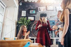 Group Of Students Handing Out Together Girl Watching Movies In 3d Virtual Reality Goggles Friends Waiting For Their Turn In Cafe In 2020 Virtual Reality Goggles 3d Virtual Reality Virtual Reality