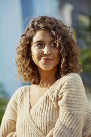 The combination of the height in the back and the long, layered front pieces results in a hairstyle that looks great from every angle. Long Curly Bob Promotions
