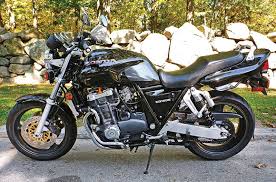 Speaking of rubber, the kawasaki cafe's handlebar clamps are mounted in the stuff, where the honda's bar bolts. Retrospective Honda Cb1000 1994 1996 Rider Magazine Rider Magazine