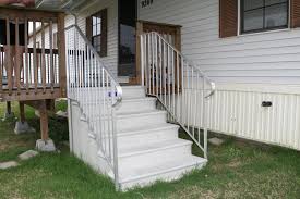 Steel brackets are bolted to the foundation using concrete anchors. Concrete Steps Century Group