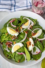 With so many ways to cook eggs, there is an ordering language just for eggs. Spinach Salad With Warm Bacon Dressing And Hard Boiled Eggs Is A Classic Favorite And Perfect For Ente Spinach Salad Cooked Spinach Recipes Warm Bacon Dressing