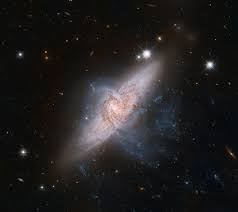 Latest views the raw hubble images, as beamed down from the telescope itself, are black and white. A Cosmic Clash Of Galaxies No But It Sure Looks That Way