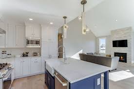 Engineered Wood Flooring Sleek Quartz Counters Beautiful Ledgestone Fireplace And Clean Tile Backsplash All Engineered Wood Floors Royal Oak Homes Flooring