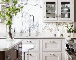 Brown, blue, yellow and green tumbled marble backsplashes are quite common, as these earthy tones can often lend warmth and light to kitchen designs. Marble Backsplash Usage And Design Ideas