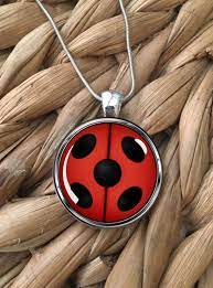 Miraculous Ladybug Pendant Necklace By Moonpoppydesigns On Etsy Pink Pendant Necklace Glass Pendant Necklace Pink Pendants